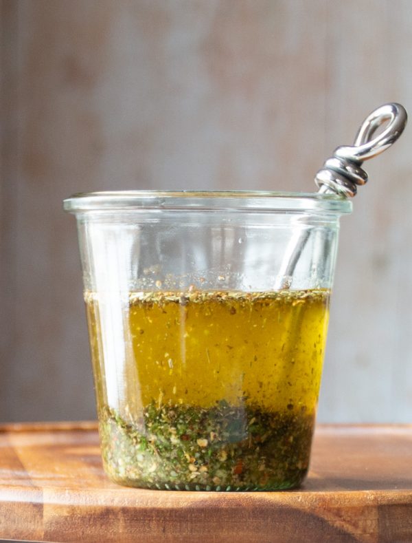 Jar of pesto herb oil