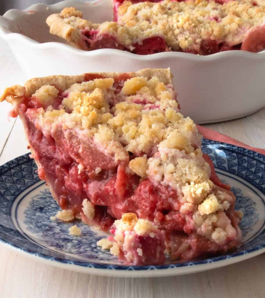 a piece of deep dish strawberry rhubarb pie on a plate