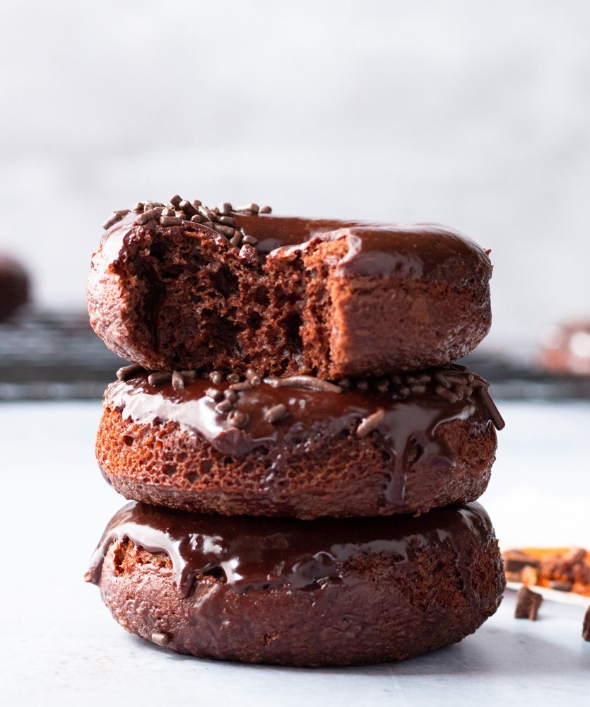 A stack of Duncan Hines baked chocolate donuts with a spicy sweet ganache.