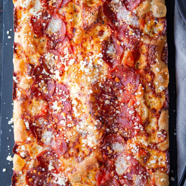 The Red Stripe Detroit Style Pizza on a cutting board